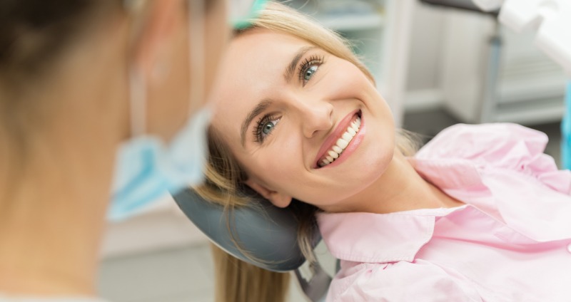 Smiling female patient at the orthodontist
