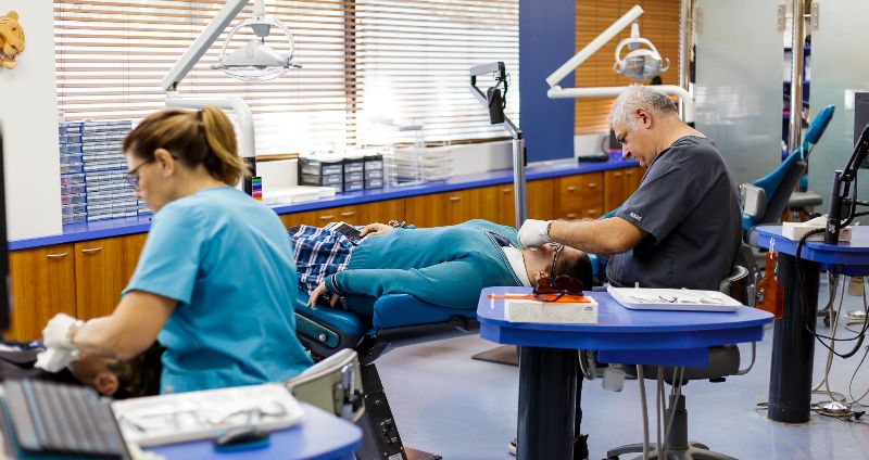 A highly skilled orthodontist conducting an appointment