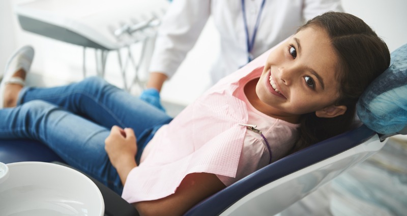 Young girl having her teeth examined at her first orthodontic consultation. 