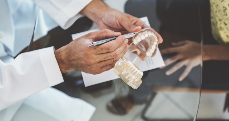 Orthodontist presenting a patients treatment plan for orthodontic braces. 